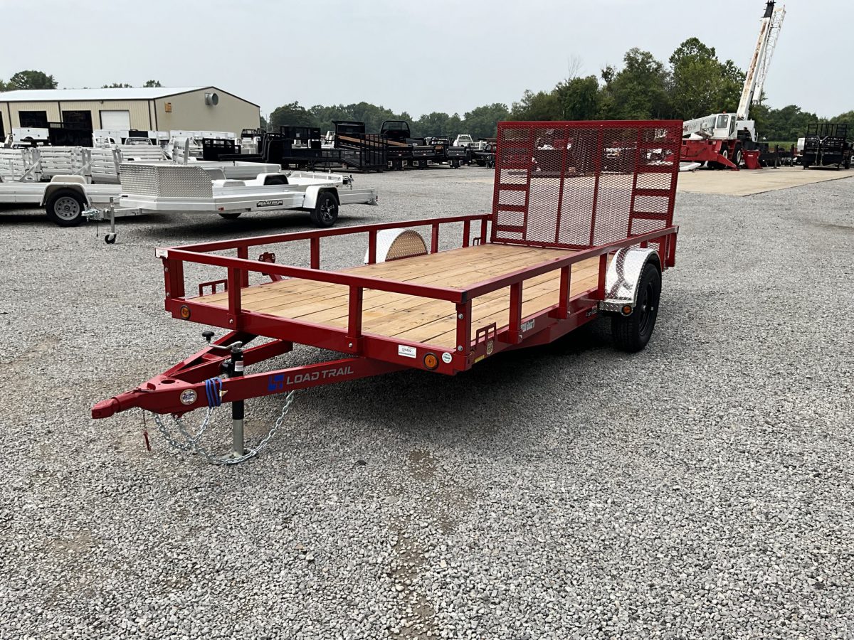 A red Load Trail utility trailer on our lot.