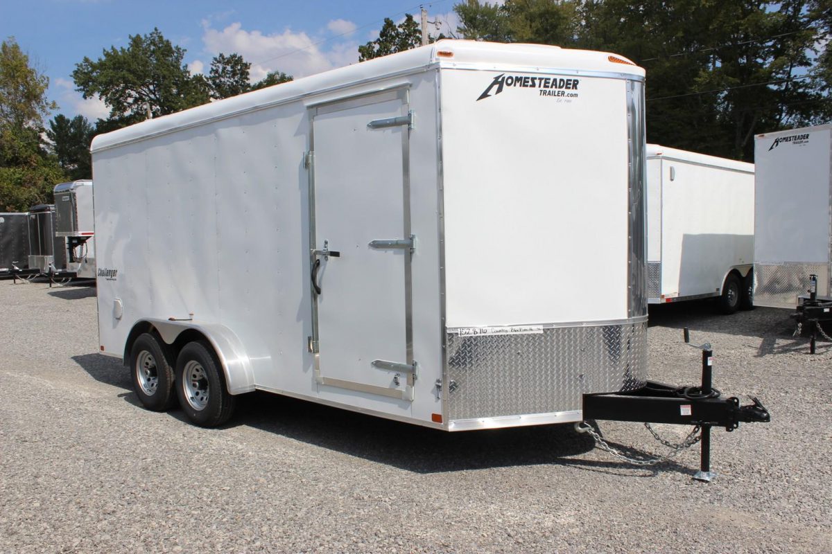 White enclosed trailers on the Country Blacksmith lot.